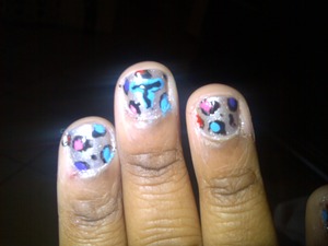 Sliver base, colourful leopard print  , with a T for Tina
