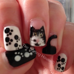 Hand painted kitty portrait manicure.