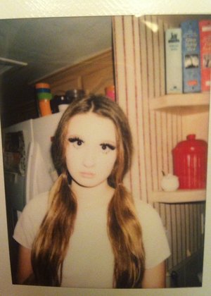 My friend took this polaroid of me at a party we were at, and I thought it looked pretty cool. This was my makeup and hair look for my costume, although you can't see it well because of the polaroid having high exposure. 
