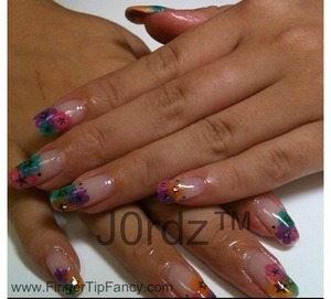 http://fingertipfancy.com/multi-color-flower-nails