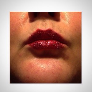Glitter and Rhinestones added onto red lipstick 