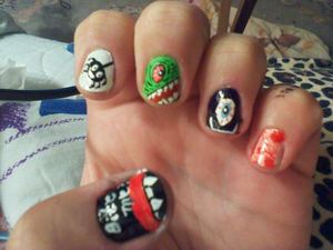 my favorite set so far. 
thumb inspired by true blood, pointer is spider on a web, middle is a green hairy monster, ring is black friendly cyclops, pinky inspired by Dexter, blood splatter.