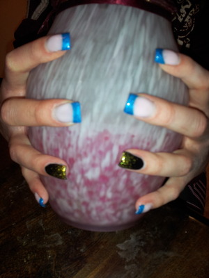 Gels with blue tips and accent nail with gold glitter