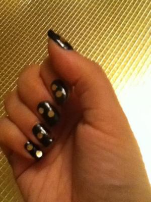 Sally Hanson Black nail polish then applied gold sequins from craft store. Finished with top coat