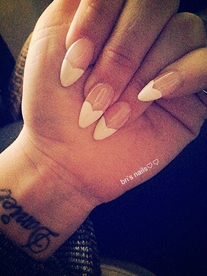 white heart polished on tip of super pink clear acrylic stiletto nails