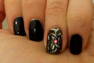 the background on the accent nail is "deadly" from the Gothic Glam by Collection