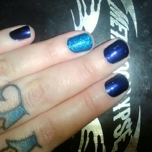 This os O.P.I Russian Navy with an accent nail of Milani One Coat Glitter in Blue Flash. So bright you gotta wear shades!