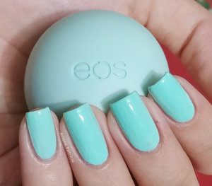 I'm holding an eos smooth sphere in the flavor Sweet Mint and this is also a swatch of Jenna Hipp Freshmaker from the What's Hot Now Nail Collection :) 