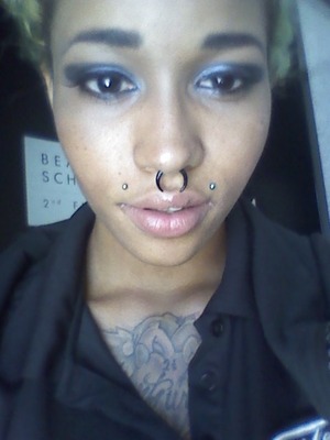 Bold blue and black eyes with winged liner and false lashes
Nude nars lip gloss