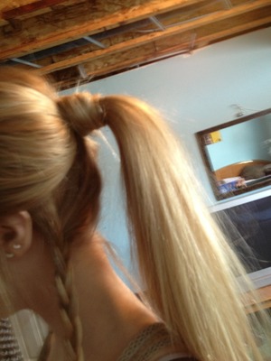 Low maintenance, but cute ponytail, hair wrapped around scrunchy, with loose braid on side. :) 