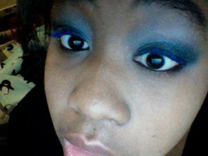 This is kind of late, but this is the really simple, but sexy look that I did on New Years, complete with electric blue lashes.