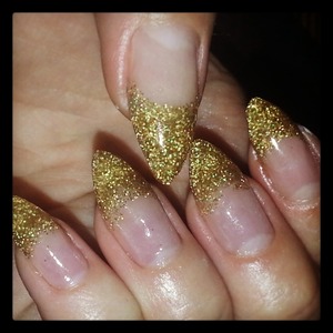 Gold glitter gel nail extensions - done with surepromise glitter gel and basic clear gel. Shaped created using form. 