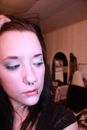 white and blue shadow with simplified liner and pink lipstick