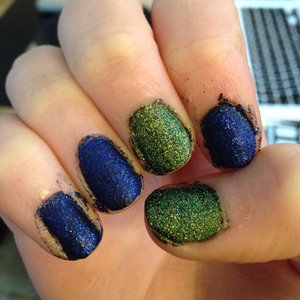 I also used SuperNails glitter in Twilight (a darker blue) and Glistening Sunshine (bright yellow) over black nail polish. 