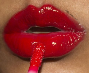 A perfect red gloss for the holidays! 
http://www.facebook.com/BellezzaBee
http://www.bellezzabee.com/2012/12/the-holiday-gloss-over.html