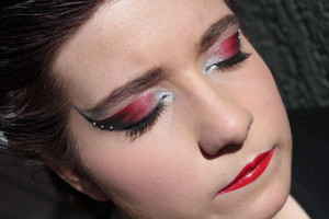 Lines and Lashes using reds and silvers
and jewels for extra special effect.