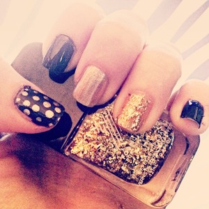 sparkly gold accent, with metallic gold nail, and navy blue with metallic gold polka dots!

