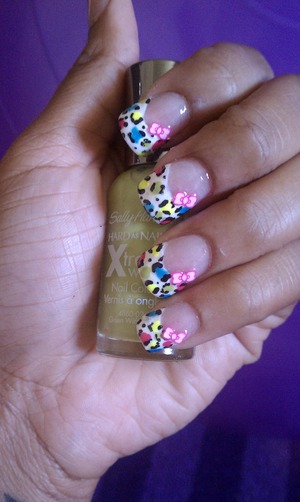 Multi colored print with pink bows.