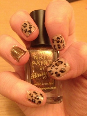My friend painted this leopard nail design for me! All she used was nail polish and dotting tools :)