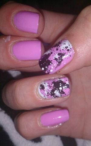 pink China glaze varnish with. white and black splatters, topped off with Revlon black and white spot top coat