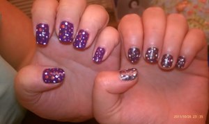 Halloween nails! Demi's nails in purple with orange, white and gunmetal black polka dots. My nails in gunmetal black with purple, orange, and white polka dots