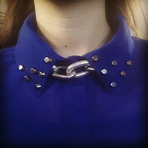 studded shirt with a silver collar chain necklace 