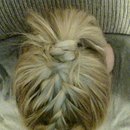 Top french braid with braid wrap and tucked under pony