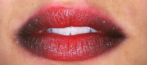 Black to a deep red to a bright red from each corner of your lips. Then some shimmer on top of your final result.