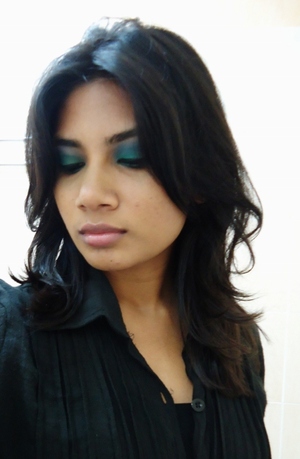 This look is done with blue & green look with a slight shimmer and a neutral lip. It's perfect for going out and about..